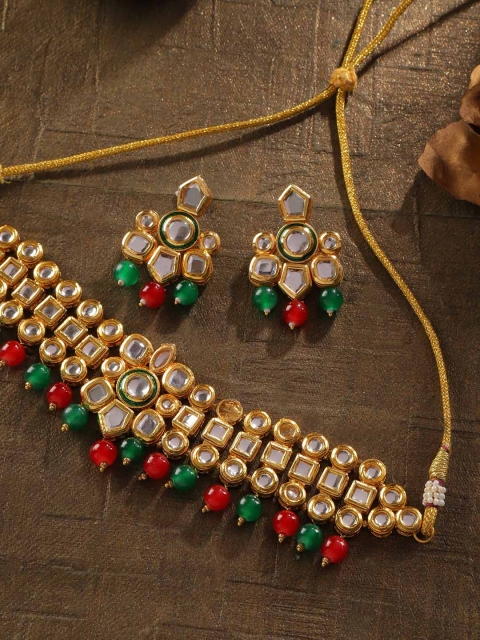 Zobby Green & Red Gold-Plated Kundan Studded & Beaded Handcrafted Choker Jewellery Set
Zobby Green & Red Gold-Plated Kundan Studded & Beaded Handcrafted Choker Jewellery Set