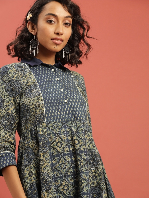 Taavi Women Blue & Green Ajrakh Hand Block Print A-Line Midi Sustainable Dress with Shirt Collar
Taavi Women Blue & Green Ajrakh Hand Block Print A-Line Midi Sustainable Dress with Shirt Collar