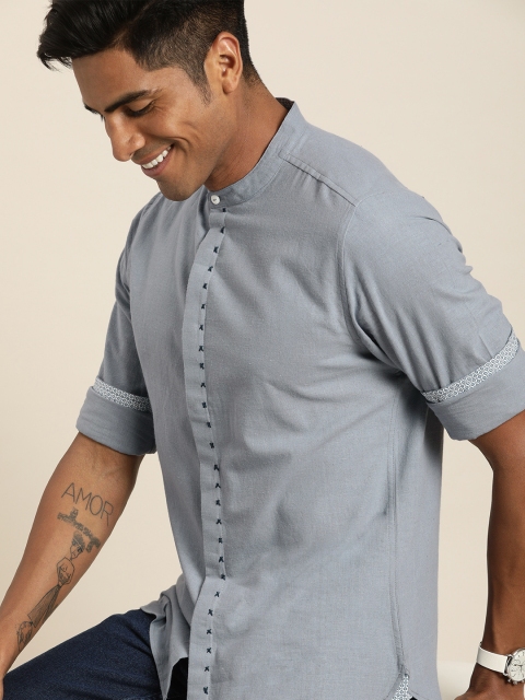 Taavi Men Blue Handloom Woven Legacy Shirt With Mandarin Collar & Concealed Button Placket
Taavi Men Blue Handloom Woven Legacy Shirt With Mandarin Collar & Concealed Button Placket