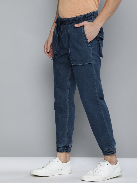 Mast & Harbour Men Blue Jogger Mid-Rise Clean Look Stretchable Cuffed Hem Cropped Jeans
Mast & Harbour Men Blue Jogger Mid-Rise Clean Look Stretchable Cuffed Hem Cropped Jeans
