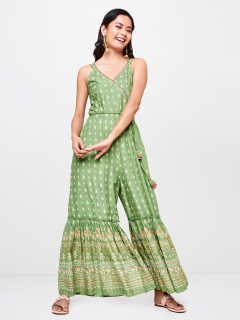 Global Desi Women Green & Gold-Toned Printed Basic Jumpsuit With Flared Hem & Waist Tie-Up
Global Desi Women Green & Gold-Toned Printed Basic Jumpsuit With Flared Hem & Waist Tie-Up