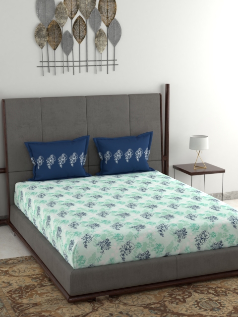 Trident White & Navy Blue Floral 144 TC Cotton 1 Queen Bedsheet with 2 Pillow Covers
Trident White & Navy Blue Floral 144 TC Cotton 1 Queen Bedsheet with 2 Pillow Covers