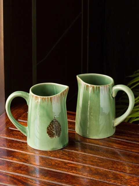 ExclusiveLane Set Of 2 Green & Brown Banyan-Leaves Hand-painted Microwave Safe Milk & Water Ceramic Jugs
ExclusiveLane Set Of 2 Green & Brown Banyan-Leaves Hand-painted Microwave Safe Milk & Water Ceramic Jugs