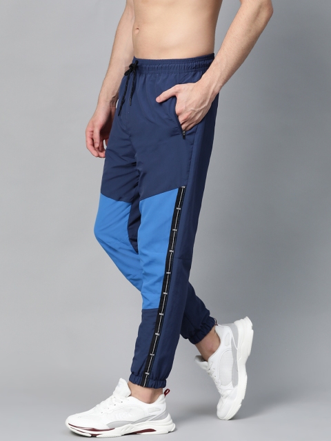 HRX by Hrithik Roshan Men Medieval Blue & Strong Blue Colourblock Regular Fit Antimicrobial Lifestyle Track Pants
HRX by Hrithik Roshan Men Medieval Blue & Strong Blue Colourblock Regular Fit Antimicrobial Lifestyle Track Pants
