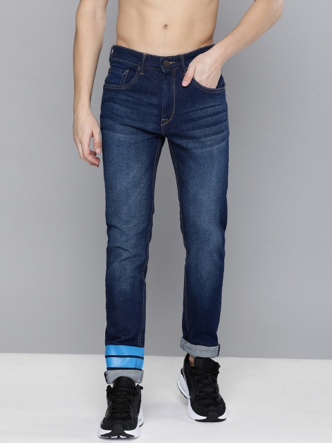 HERE&NOW Men Blue Slim Fit Mid-Rise Clean Look Stretchable Jeans with Printed Detail
HERE&NOW Men Blue Slim Fit Mid-Rise Clean Look Stretchable Jeans with Printed Detail