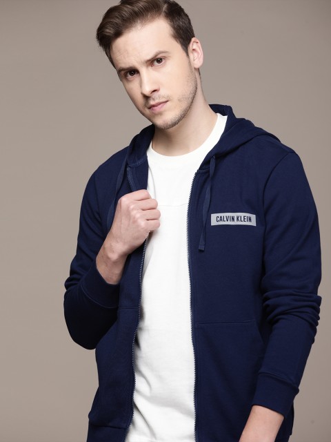 Calvin Klein Jeans Men Navy Blue Brand Logo Printed Hooded Pure Cotton Sporty Jacket
Calvin Klein Jeans Men Navy Blue Brand Logo Printed Hooded Pure Cotton Sporty Jacket