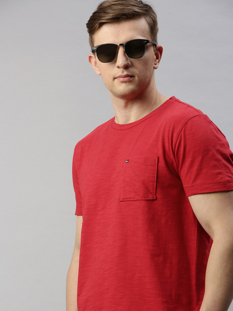 Tommy Hilfiger Men Red Solid Round Neck T-shirt With Chest Pocket
Tommy Hilfiger Men Red Solid Round Neck T-shirt With Chest Pocket