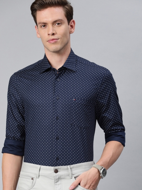 Tommy Hilfiger Men Navy Blue & White Tailored Regular Fit Printed Smart Casual Shirt
Tommy Hilfiger Men Navy Blue & White Tailored Regular Fit Printed Smart Casual Shirt