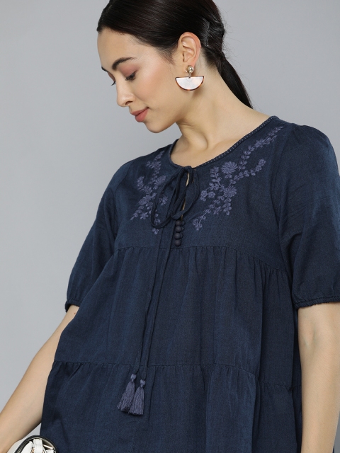 Chemistry Women Navy Blue Solid Tie-up Neck Pure Cotton Denim Tiered Top with Embroidery
Chemistry Women Navy Blue Solid Tie-up Neck Pure Cotton Denim Tiered Top with Embroidery