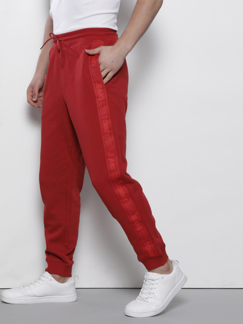 Tommy Hilfiger Men Red Solid Pure Cotton Joggers with Side Taping Detail 
Tommy Hilfiger Men Red Solid Pure Cotton Joggers with Side Taping Detail