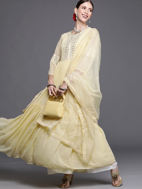 Inddus Women Yellow Ethnic Embroidered Mirror Work Anarkali Tiered Kurta with Dupatta
Inddus Women Yellow Ethnic Embroidered Mirror Work Anarkali Tiered Kurta with Dupatta