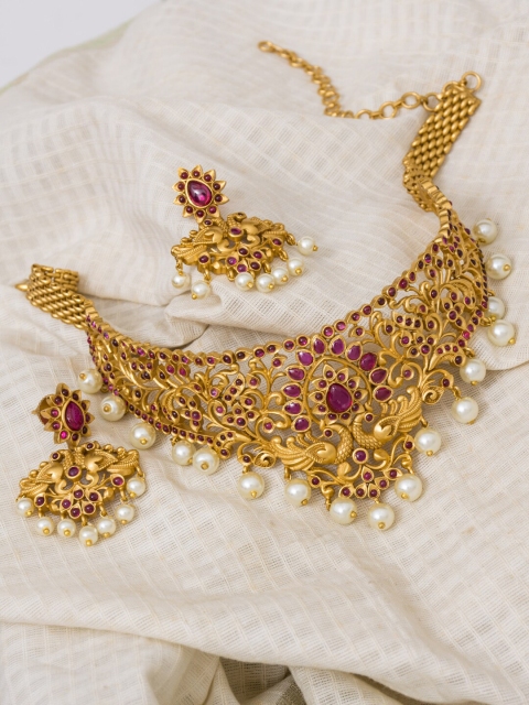 Alankruthi Gold-Plated & Pink Stone-Studded & Pearl Beaded Peacock Floral Choker Jewellery Set
Alankruthi Gold-Plated & Pink Stone-Studded & Pearl Beaded Peacock Floral Choker Jewellery Set
