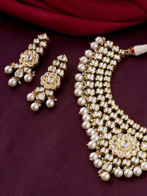 Tistabene Gold-Toned & White Kundan-Studded & Beaded Meenakari Traditional Jewellery Set
Tistabene Gold-Toned & White Kundan-Studded & Beaded Meenakari Traditional Jewellery Set