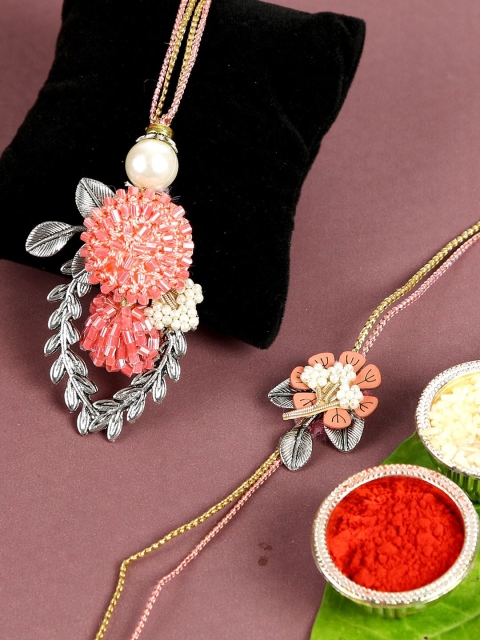 Aapno Rajasthan Silver & Peach Modern Style Beads Embellished Bhaiya Bhabhi Rakhi Set
Aapno Rajasthan Silver & Peach Modern Style Beads Embellished Bhaiya Bhabhi Rakhi Set