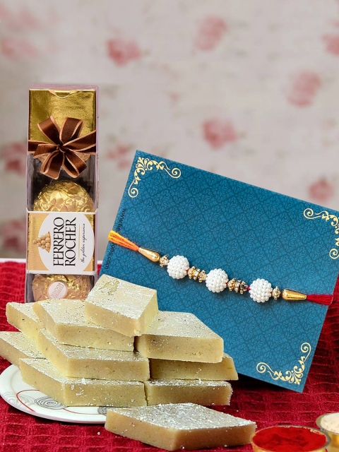 TIED RIBBONS Bhaiya Bhabhi Lumba Rakhi Set with Kaju Katli & Chocolates Combo Gift Pack, Multi
TIED RIBBONS Bhaiya Bhabhi Lumba Rakhi Set with Kaju Katli & Chocolates Combo Gift Pack, Multi