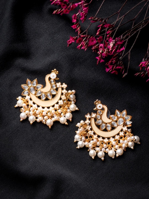 MORKANTH JEWELLERY Cream-Coloured Gold-Toned Pearl Beaded Peacock Shaped Chandbali Earring
MORKANTH JEWELLERY Cream-Coloured Gold-Toned Pearl Beaded Peacock Shaped Chandbali Earring