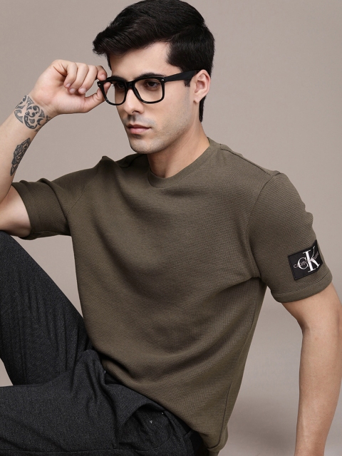 Calvin Klein Jeans Men Olive Green Self Design Pure Cotton Slim Fit Casual T-shirt
Calvin Klein Jeans Men Olive Green Self Design Pure Cotton Slim Fit Casual T-shirt