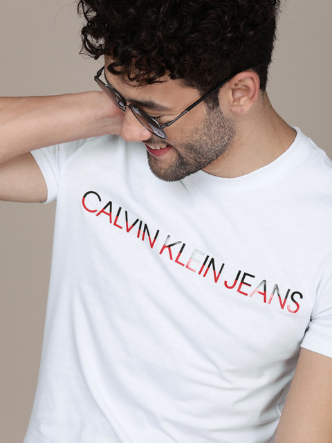 Calvin Klein Jeans Men White Logo Printed Regular Fit Pure Cotton Casual Pure Cotton T-shirt 
Calvin Klein Jeans Men White Logo Printed Regular Fit Pure Cotton Casual Pure Cotton T-shirt