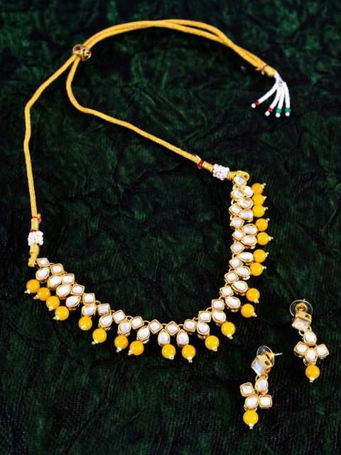 Crunchy Fashion Gold-Plated Yellow & White Kundan-Studded Beaded Traditional Jewellery Set
Crunchy Fashion Gold-Plated Yellow & White Kundan-Studded Beaded Traditional Jewellery Set