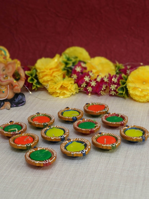TIED RIBBONS Set of 12 Handmade Wax Filled Terracotta Clay Diwali Diya Candle Holders, Multi
TIED RIBBONS Set of 12 Handmade Wax Filled Terracotta Clay Diwali Diya Candle Holders, Multi