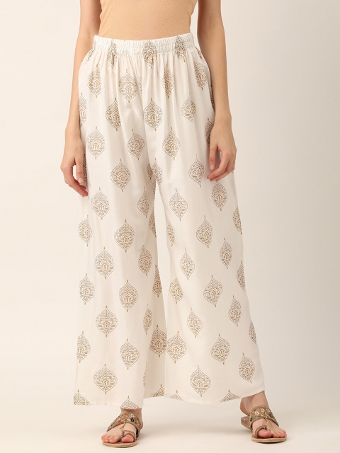 V2 Value & Variety Women White & Gold-Toned Ethnic Motifs Printed Knitted Ethnic Palazzos
V2 Value & Variety Women White & Gold-Toned Ethnic Motifs Printed Knitted Ethnic Palazzos