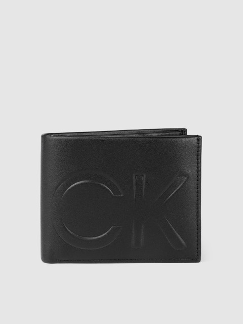 Calvin Klein Men Black Solid Leather Two Fold Wallet with Brand Logo Embossed
Calvin Klein Men Black Solid Leather Two Fold Wallet with Brand Logo Embossed