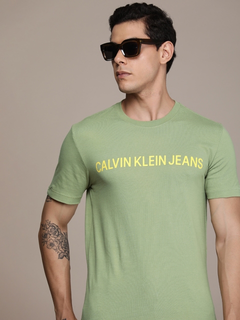 Calvin Klein Jeans Men Olive Green Typography Printed Organic Cotton Slim Fit T-shirt
Calvin Klein Jeans Men Olive Green Typography Printed Organic Cotton Slim Fit T-shirt