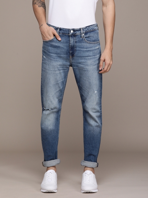 Calvin Klein Jeans Men Blue Tapered Fit Mildly Distressed Heavy Fade Stretchable Jeans
Calvin Klein Jeans Men Blue Tapered Fit Mildly Distressed Heavy Fade Stretchable Jeans