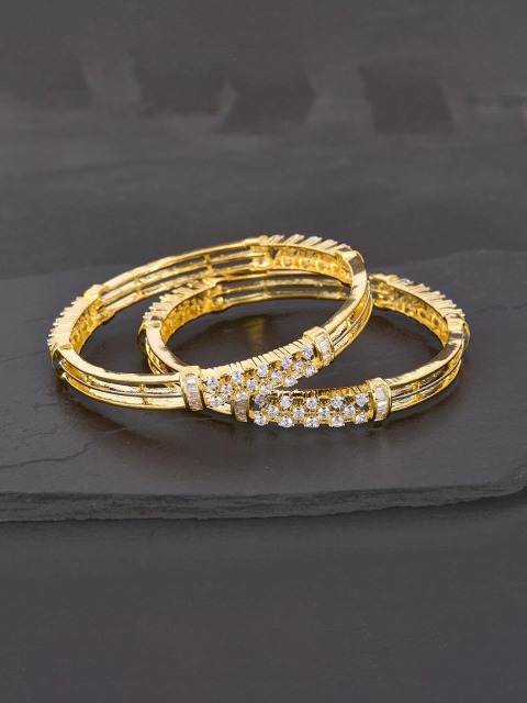 Tistabene Set Of 2 Gold-Toned Gold-Plated Stone-Studded Contemporary Modern Kada Bangles
Tistabene Set Of 2 Gold-Toned Gold-Plated Stone-Studded Contemporary Modern Kada Bangles