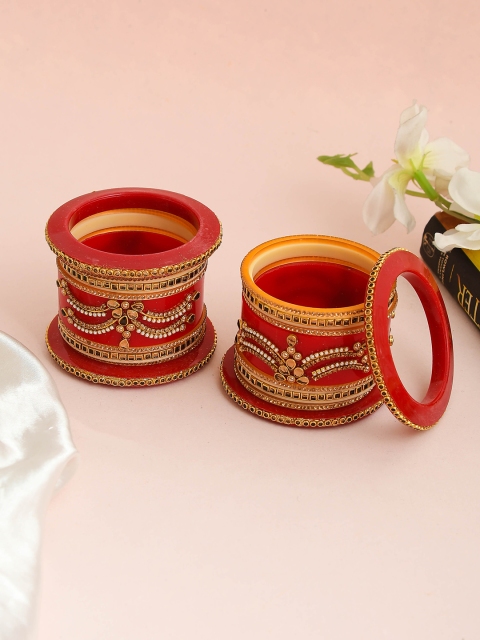 Silvermerc Designs Woman Set of 18 Gold Plated Red and White Stone Studded Wedding Bangles
Silvermerc Designs Woman Set of 18 Gold Plated Red and White Stone Studded Wedding Bangles