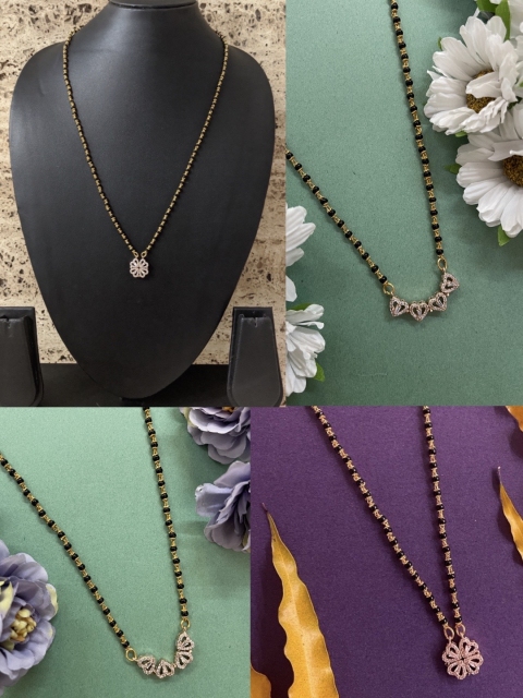 Digital Dress Room Rose Gold-Plated Black-Beaded White AD-Studded Heart Reversible Mangalsutra
Digital Dress Room Rose Gold-Plated Black-Beaded White AD-Studded Heart Reversible Mangalsutra