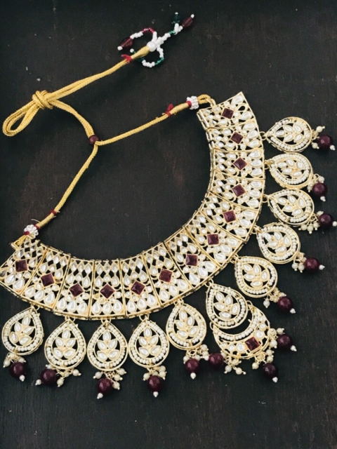 The Opal Factory Gold-Plated Maroon & White Stone Studded & Beaded Jadau Jewellery Set
The Opal Factory Gold-Plated Maroon & White Stone Studded & Beaded Jadau Jewellery Set