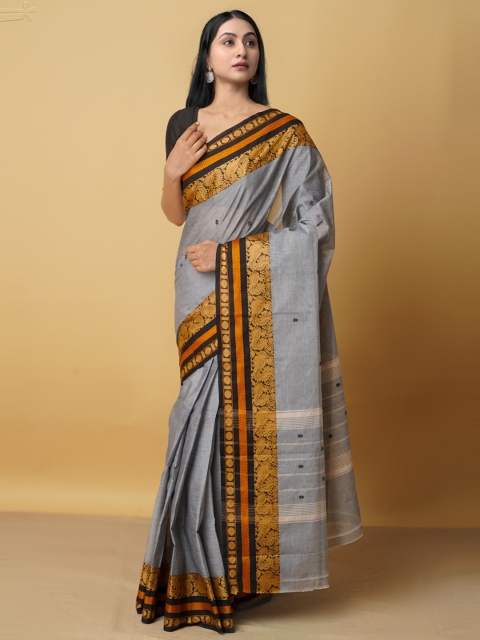 Unnati Silks Women Grey & Mustard Ethnic Motifs Zari Pure Cotton Kanjeevaram Saree
Unnati Silks Women Grey & Mustard Ethnic Motifs Zari Pure Cotton Kanjeevaram Saree