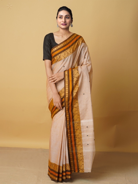 Unnati Silks Cream-Coloured & Brown Ethnic Motifs Zari Pure Cotton Kanjeevaram Saree
Unnati Silks Cream-Coloured & Brown Ethnic Motifs Zari Pure Cotton Kanjeevaram Saree