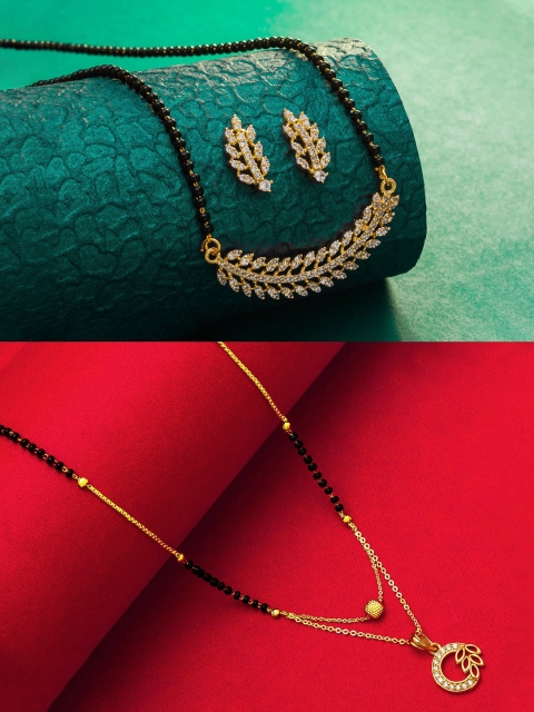 aadita Set Of 2 Gold-Plated White Stone-Studded & Black-Beaded Mangalsutra With Earring
aadita Set Of 2 Gold-Plated White Stone-Studded & Black-Beaded Mangalsutra With Earring