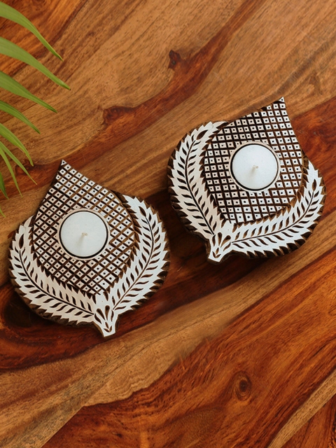 ExclusiveLane 'Resplendent Leaves' Hand-Carved Blocks Tea-Light Holders (Set of 2), Brown
ExclusiveLane 'Resplendent Leaves' Hand-Carved Blocks Tea-Light Holders (Set of 2), Brown