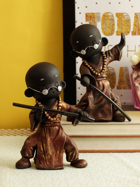 TIED RIBBONS Set of 2 Bronze & Black Action & Fighting Pose Lord Buddha Monk Showpieces
TIED RIBBONS Set of 2 Bronze & Black Action & Fighting Pose Lord Buddha Monk Showpieces