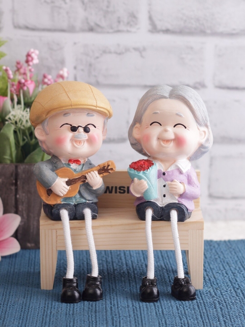 WISHTANK Set Of 2 Multicoloured Cute Grandparent Couple With Hanging Legs Showpieces, Multi
WISHTANK Set Of 2 Multicoloured Cute Grandparent Couple With Hanging Legs Showpieces, Multi
