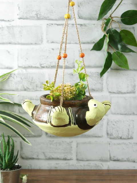 Aapno Rajasthan Green & Brown Handcrafted Terracotta Turtle Shaped Beaded Hanging Planter
Aapno Rajasthan Green & Brown Handcrafted Terracotta Turtle Shaped Beaded Hanging Planter