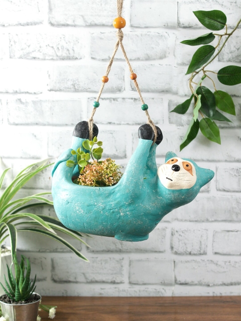 Aapno Rajasthan Turquoise Blue Handcrafted Terracotta Racoon Shaped Beaded Hanging Planter
Aapno Rajasthan Turquoise Blue Handcrafted Terracotta Racoon Shaped Beaded Hanging Planter