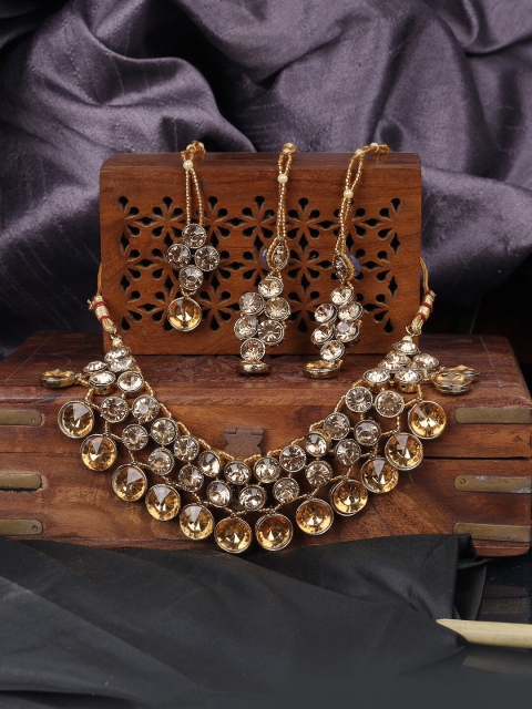ANIKAS CREATION Gold-Plated & Tan Brown Stone Studded Handcrafted Traditional Choker Jewellery Set
ANIKAS CREATION Gold-Plated & Tan Brown Stone Studded Handcrafted Traditional Choker Jewellery Set