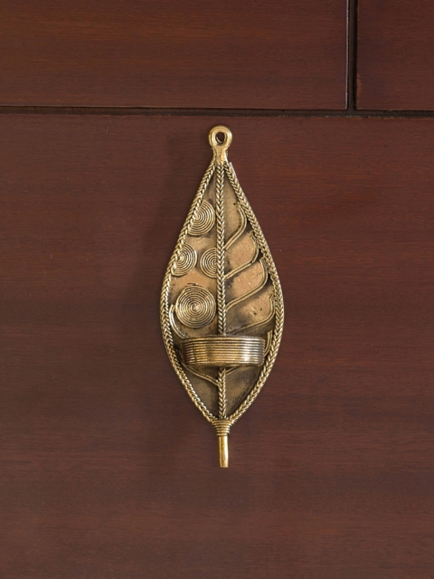 ExclusiveLane "Illuminated Leaf" Brass Wall Pillar Candle Holder Handmade in Dokhra Art, Gold
ExclusiveLane "Illuminated Leaf" Brass Wall Pillar Candle Holder Handmade in Dokhra Art, Gold
