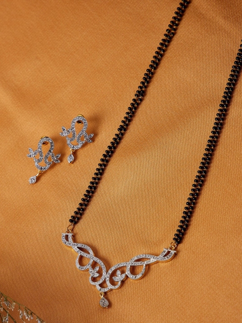 ZeroKaata Gold-Plated & Black Beaded American Diamond Embellished Classic Sleek Pendant Mangalsutra With Earrings
ZeroKaata Gold-Plated & Black Beaded American Diamond Embellished Classic Sleek Pendant Mangalsutra With Earrings