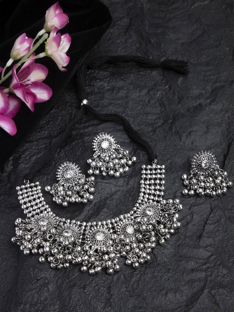 Moedbuille White Stones & Ghungroo Studded Oxidised Silver Plated Handcrafted Jewelry Set with Ring
Moedbuille White Stones & Ghungroo Studded Oxidised Silver Plated Handcrafted Jewelry Set with Ring