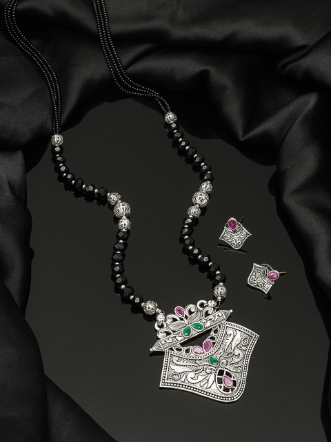 aadita Tribal Oxidised Silver-Toned & Black Stone-Studded Tribal Mangalsutra with Earrings
aadita Tribal Oxidised Silver-Toned & Black Stone-Studded Tribal Mangalsutra with Earrings