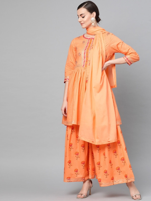 Ishin Women Orange Ethnic Motifs Yoke Design Panelled Pure Cotton Kurta with Sharara & With Dupatta
Ishin Women Orange Ethnic Motifs Yoke Design Panelled Pure Cotton Kurta with Sharara & With Dupatta
