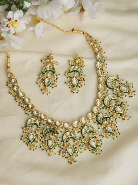 INDYA Gold-Plated White & Green Stone-Studded & Beaded Crescent-Shaped Meenakari Jewellery Set
INDYA Gold-Plated White & Green Stone-Studded & Beaded Crescent-Shaped Meenakari Jewellery Set