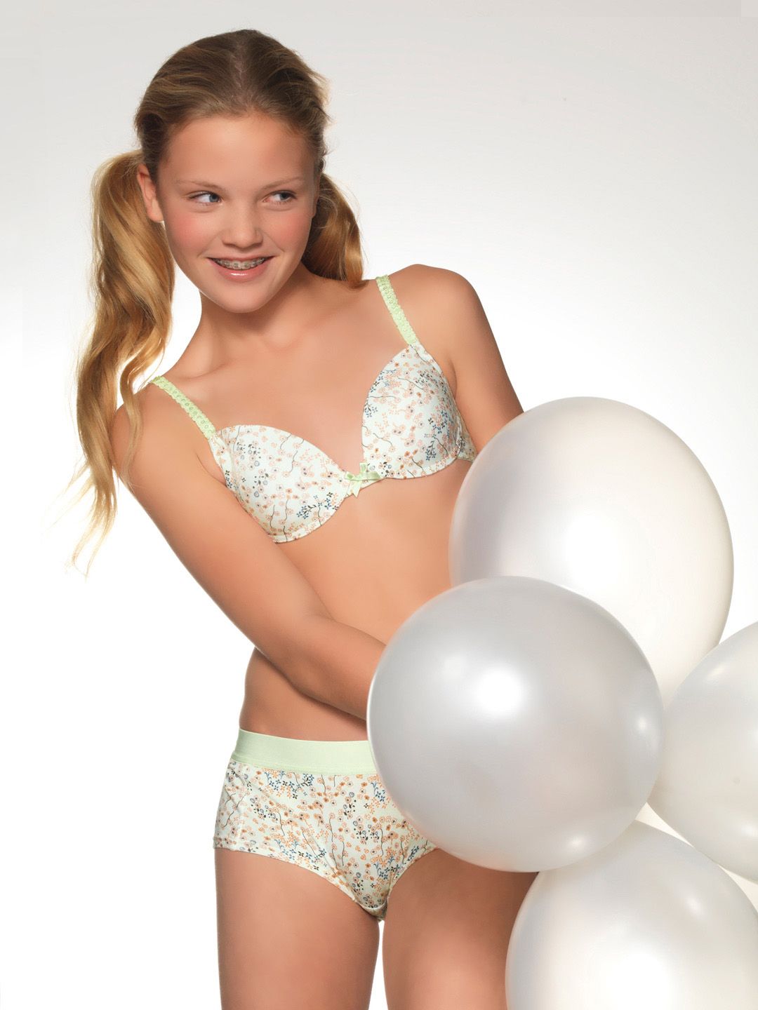 girl in pink floral-printed training bra