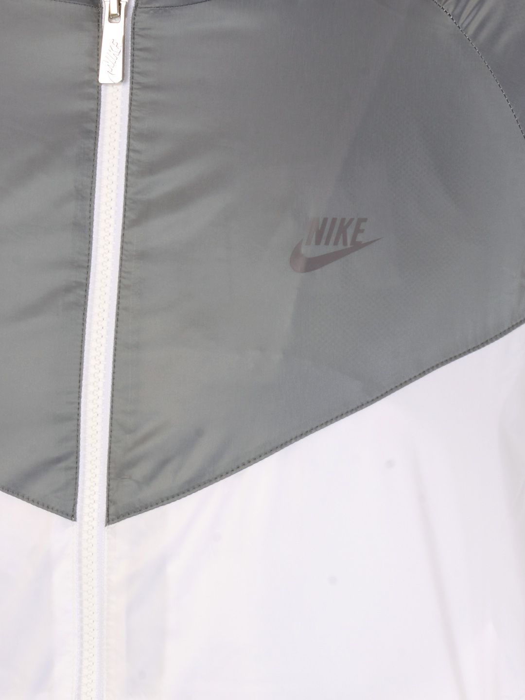 white and silver nike windbreaker