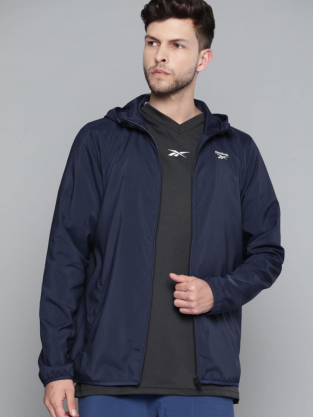 Reebok Men Navy Blue Solid Training Sporty Jacket